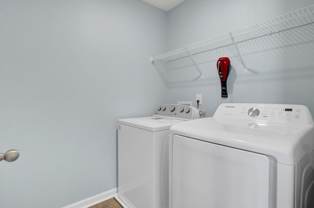 clothes washing area with independent washer and dryer