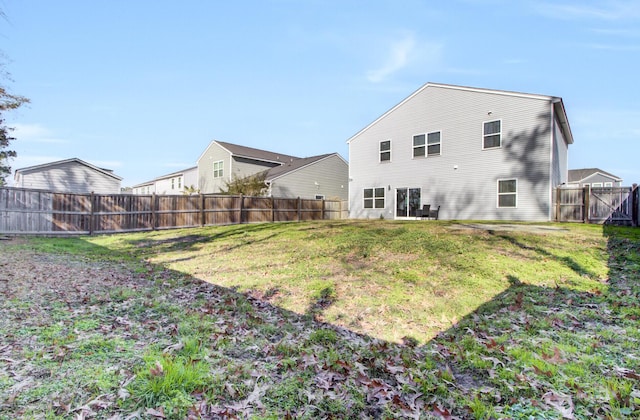 rear view of house with a lawn