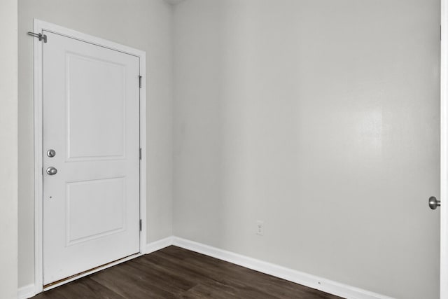 empty room with dark wood-type flooring