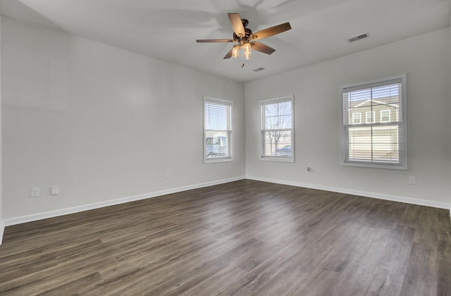 unfurnished room featuring ceiling fan and dark hardwood / wood-style floors