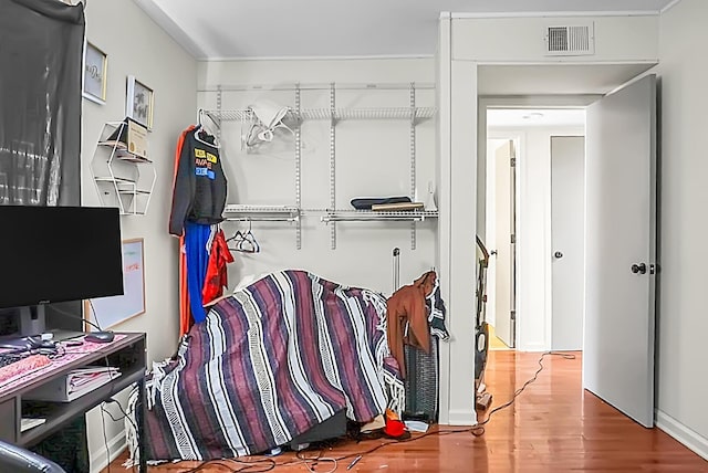 spacious closet with wood finished floors and visible vents