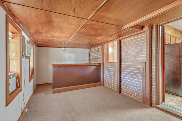 interior space with cooling unit, wooden ceiling, and baseboards