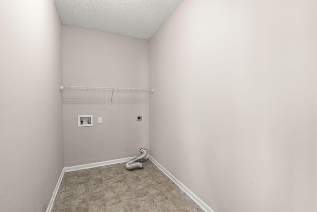 washroom featuring washer hookup, a textured ceiling, and hookup for an electric dryer