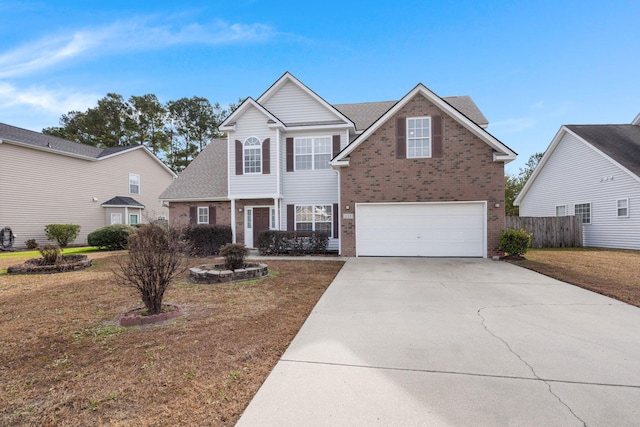 view of front property featuring a front lawn and a garage