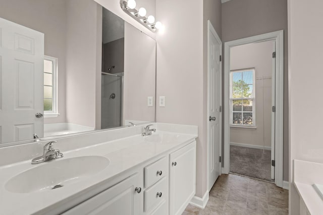 bathroom with tile patterned floors, vanity, and independent shower and bath