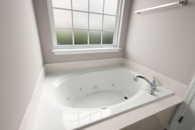 bathroom featuring a tub to relax in