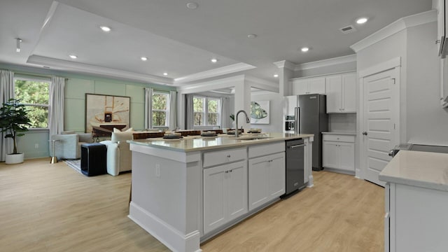 212 Bilge Rd, Ridgeville, SC 29472 - kitchen featuring a sink, dishwashing machine, crown molding, a raised ceiling, and healthy amount of natural light