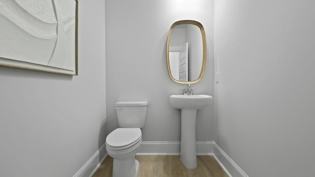 212 Bilge Rd, Ridgeville, SC 29472 - bathroom featuring toilet, wood finished floors, and baseboards