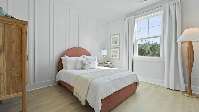 212 Bilge Rd, Ridgeville, SC 29472 - bedroom featuring light wood-style flooring and baseboards