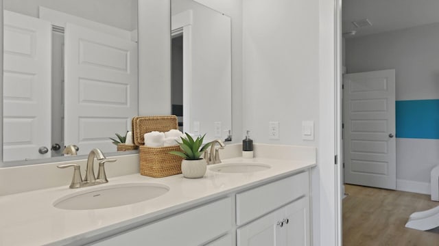 212 Bilge Rd, Ridgeville, SC 29472 - bathroom with double vanity and wood finished floors