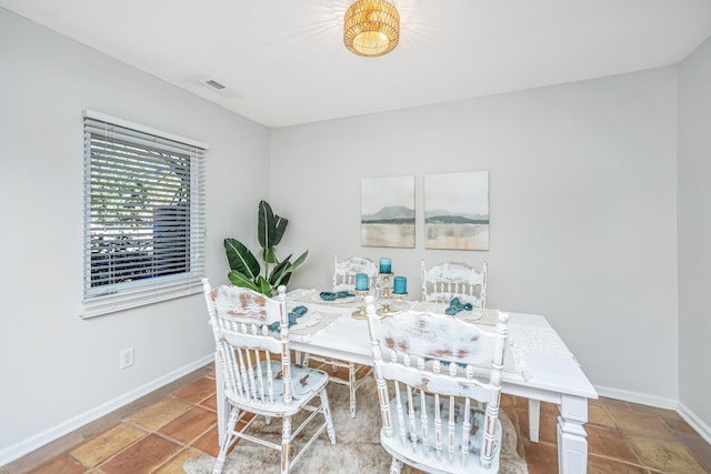 dining area featuring visible vents and baseboards