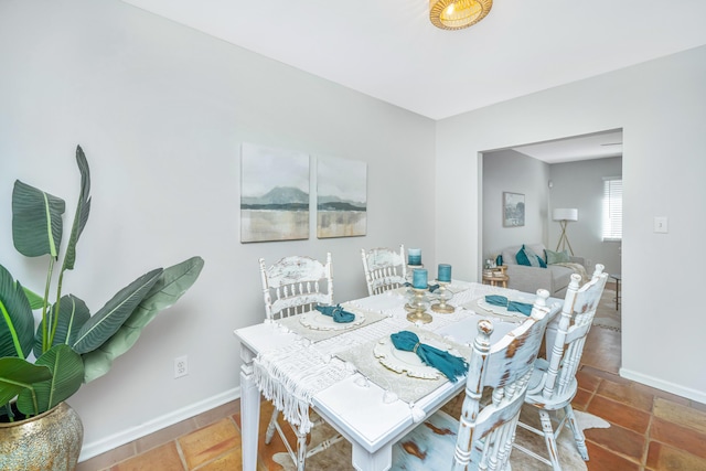 dining room featuring baseboards