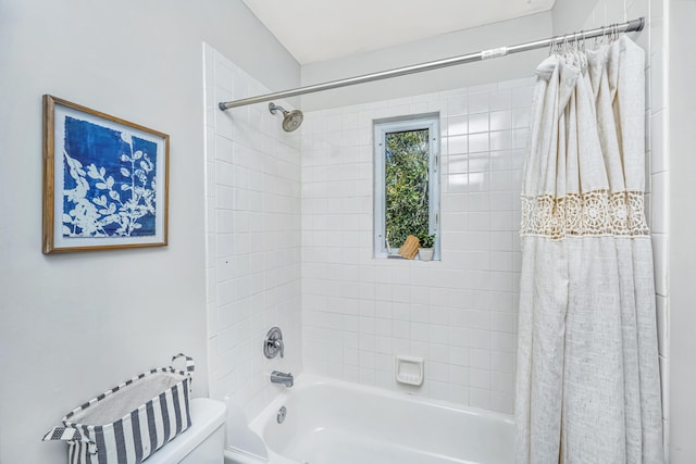 full bathroom featuring shower / tub combo and toilet