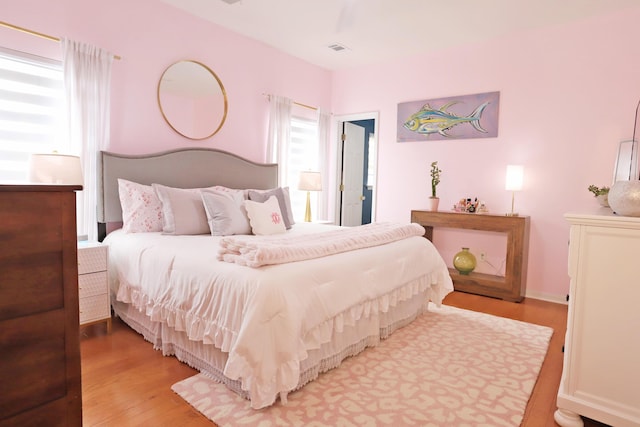 bedroom with wood finished floors