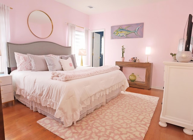 bedroom featuring wood finished floors