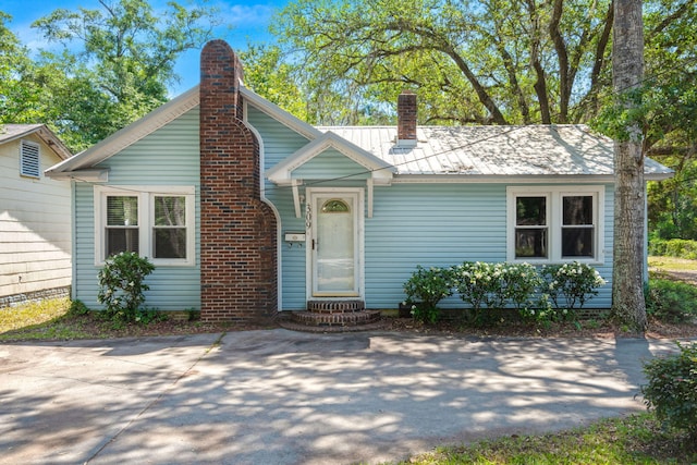 309 Padgett Loop, Walterboro, SC 29488 - bungalow-style home with a chimney, entry steps, and metal roof