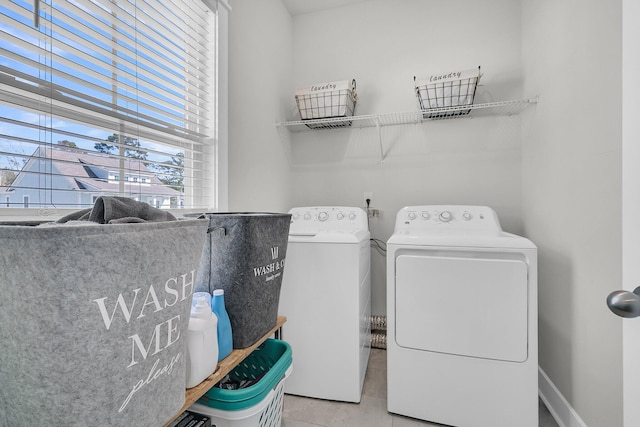 laundry room featuring washing machine and clothes dryer and laundry area