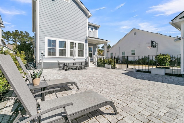 view of patio / terrace featuring fence