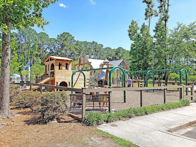 communal playground featuring fence