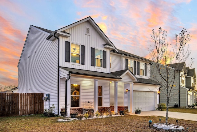 view of front of home featuring a garage and covered porch