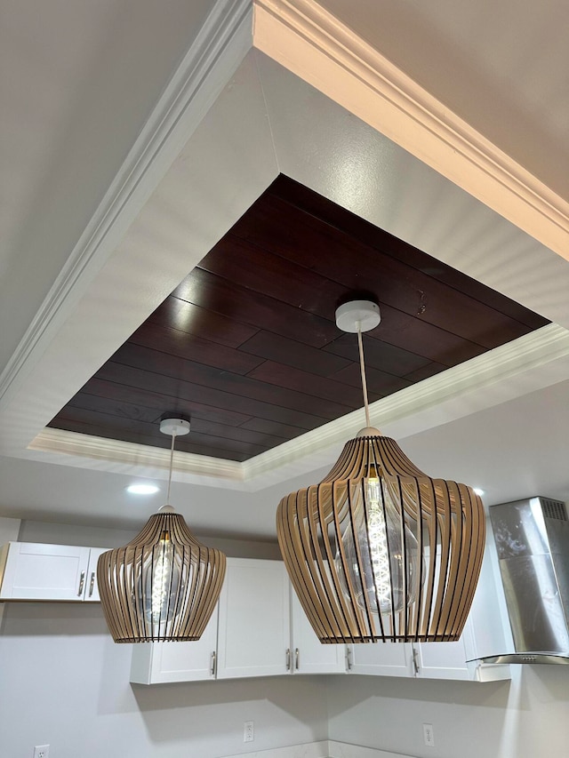 details with ornamental molding and a tray ceiling