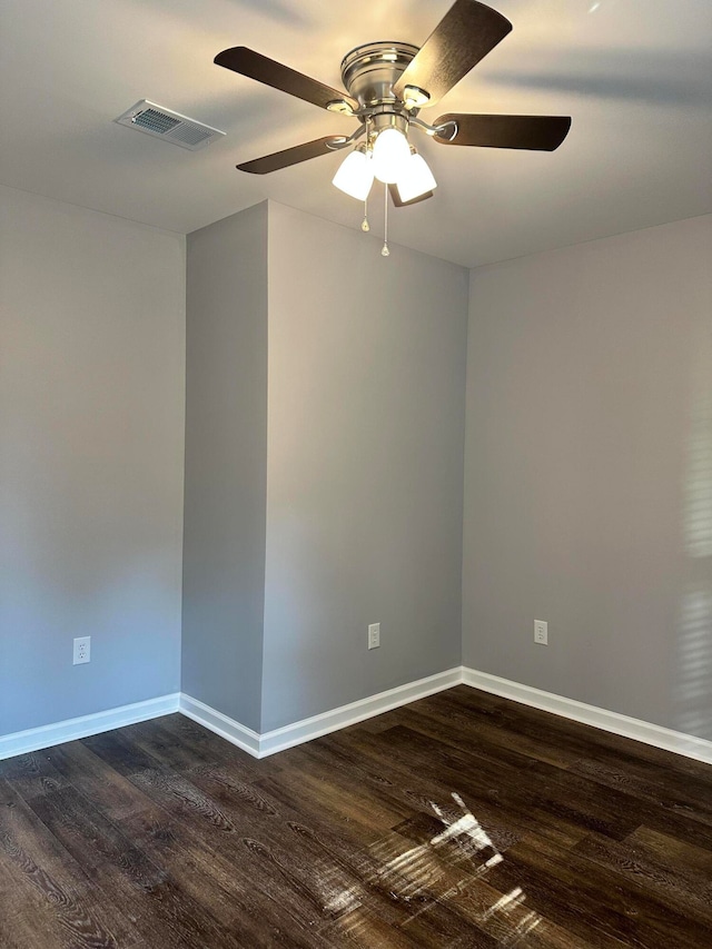 unfurnished room featuring ceiling fan and dark hardwood / wood-style floors