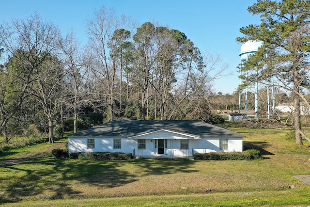 view of front of home with covered porch and a front yard