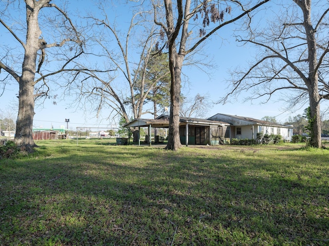 view of yard featuring a carport