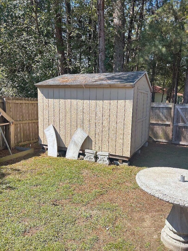 view of outbuilding with a lawn