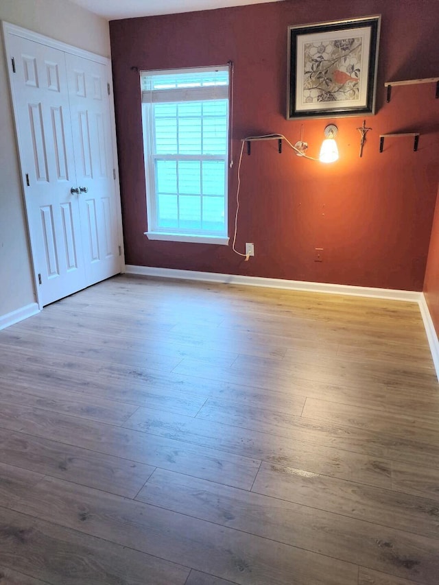 spare room with light wood-type flooring