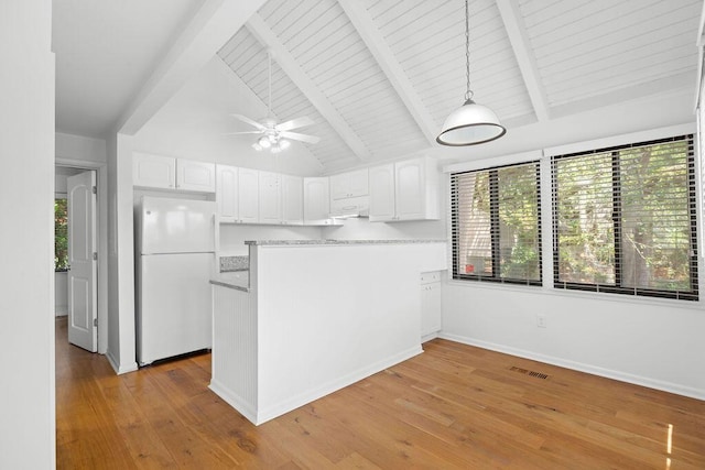 811 Treeloft Trce, Seabrook Island, SC 29455 - kitchen featuring freestanding refrigerator, white cabinetry, a peninsula, and light wood-style flooring