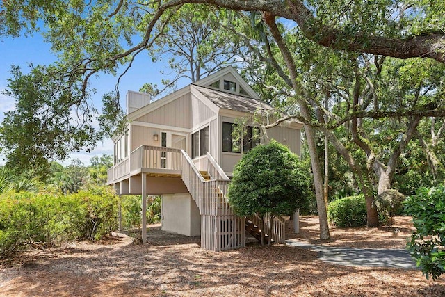 811 Treeloft Trce, Seabrook Island, SC 29455 - view of front facade with stairway and a chimney