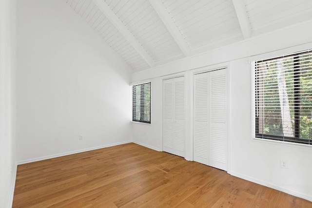 811 Treeloft Trce, Seabrook Island, SC 29455 - unfurnished bedroom with light wood-type flooring, multiple windows, two closets, and wooden ceiling