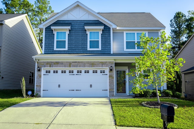 craftsman house with a garage and a front yard