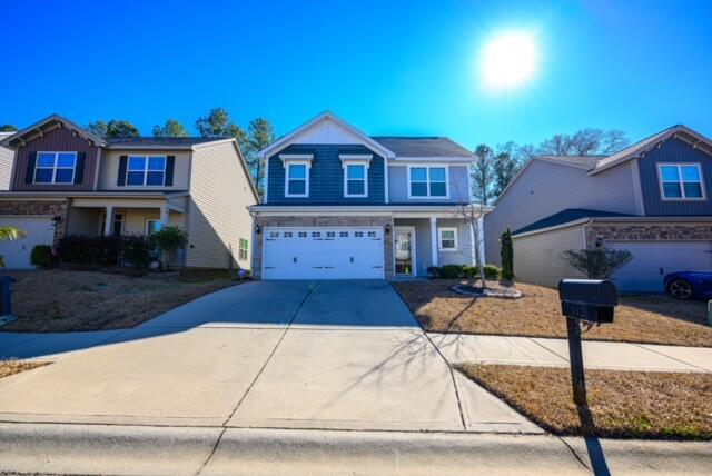 front of property with a garage