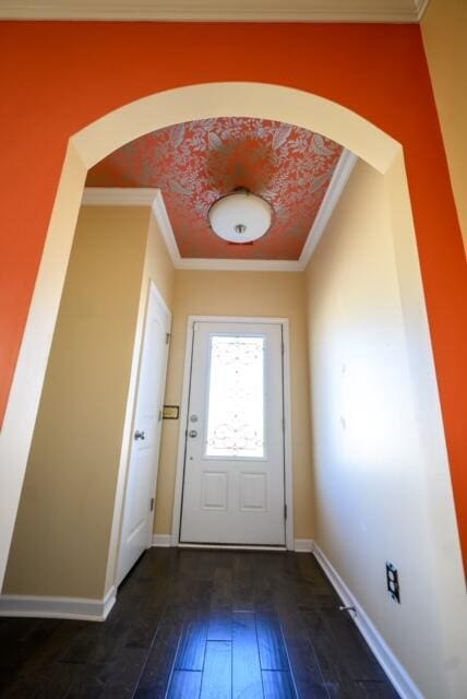 doorway to outside with dark hardwood / wood-style flooring and ornamental molding