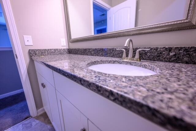 bathroom featuring tile patterned floors and vanity