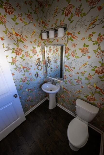 bathroom featuring toilet and hardwood / wood-style flooring