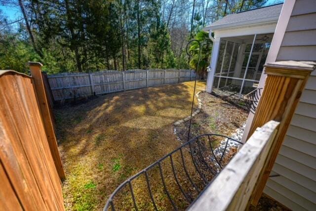 view of yard with a sunroom