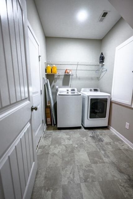 laundry room featuring washing machine and dryer