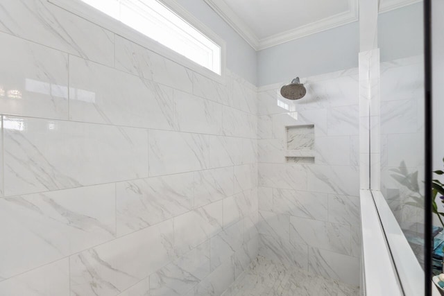 full bath featuring a tile shower and crown molding