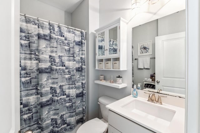 bathroom with vanity, toilet, and a shower with curtain