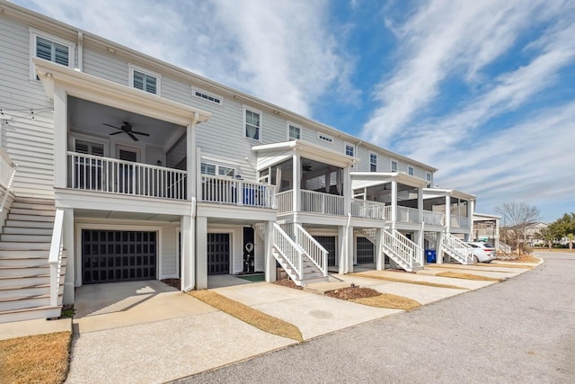 exterior space featuring stairs, driveway, and a garage