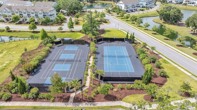 birds eye view of property with a water view and a residential view