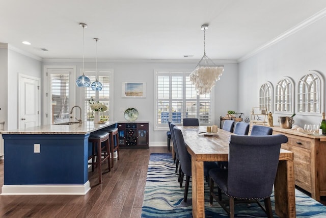 dining space with plenty of natural light, ornamental molding, a chandelier, and dark wood-type flooring