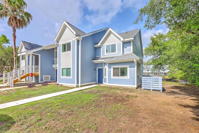 851 Sandlake Dr Unit D, Mount Pleasant, SC 29464 - view of front of house featuring roof with shingles and a front yard