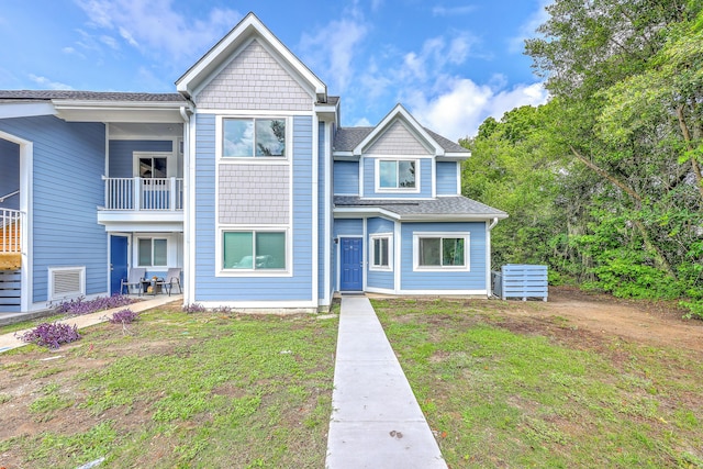 851 Sandlake Dr Unit D, Mount Pleasant, SC 29464 - townhome / multi-family property with a front yard, a shingled roof, and a balcony