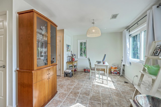 851 Sandlake Dr Unit D, Mount Pleasant, SC 29464 - dining area featuring healthy amount of natural light, light stone finish flooring, and baseboards