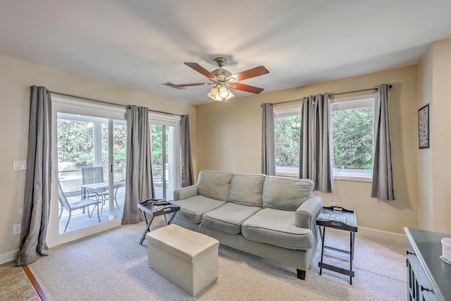 851 Sandlake Dr Unit D, Mount Pleasant, SC 29464 - living room featuring a ceiling fan, baseboards, and light colored carpet