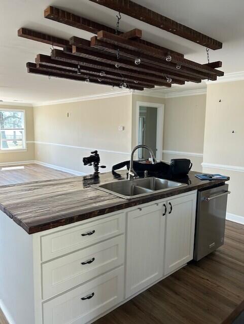 2222 Lakeshore Dr, Manning, SC 29102 - kitchen featuring stainless steel dishwasher, a sink, dark countertops, and white cabinetry